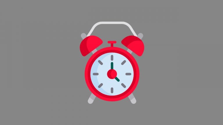 A red and white cartoon alarm clock sits on a dark grey background. The image conveys that the post will discuss how long you should talk for in IELTS Speaking Part 1