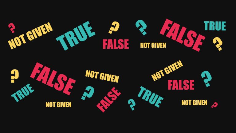 A black background is covered with question marks and red false, yellow Not Given and blue True words. The picture symbolise the difficulty of IELTS True, False, Not Given questions and the necessity for high-level reading skills